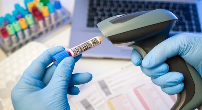 Scanning a barcode on a lab sample for a sample management system